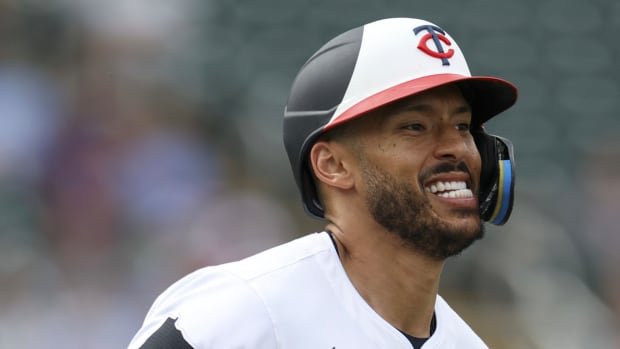 Mar 6, 2024; Fort Myers, Florida, USA; Minnesota Twins shortstop Carlos Correa (4) tries to run out a ground ball against the Boston Red Sox in the fifth inning at Hammond Stadium.